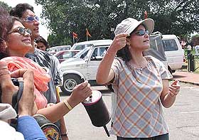 Women participate in a kite flying festival