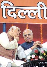 ALL EARS: Delhi Pradesh BJP president Madan Lal Khurana with Deputy Prime Minister L.K. Advani during a Parivartan Rally, organised by Delhi Pradesh BJP at Indira Gandhi Stadium in the Capital on Sunday.