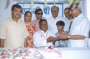 Mr C. P. Jain, Chairman and Managing Director, NTPC, on Sunday handed over the keys of a prefabricated telephone booth to a physically challenged person at Naraina in the Capital
