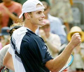 Andy Roddick of the US celebrates his semifinal victory over Switzerland's Roger Federer 
