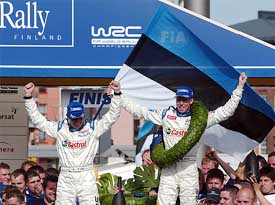 Estonian Markko Martin and his British co-driver Michael Park celebrate after winning the Finland Motor Rally 