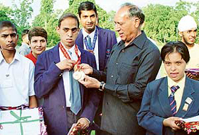 Medal winners of Special Olympics being honoured by Justice O.P. Verma, Governor, Punjab, at Punjab Raj Bhavan, Chandigarh, on Monday.