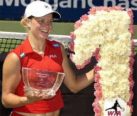 Belgium's Kim Clijsters poses with the trophy after defeating  Lindsay Davenport of the US in the final of the JP Morgan Chase Open 