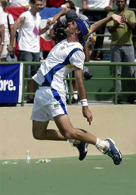 Fernando Meligeni of Brazil celebrates after winning the gold medal in the men's tennis event at the XIV Pan American Games 