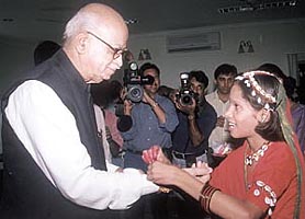 A girl tying rakhi on the wrist of Deputy Prime Minister L.K. Advani at his residence on Raksha Bandhan in the Capital on Tuesday. 