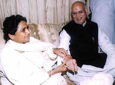 Uttar Pradesh Chief Minister Mayawati ties a rakhi on the wrist of BJP leader Lalji Tandon