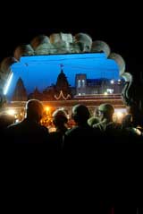 Policemen stand guard during the first 'Snahi Snan" in a sacred pond at the ongoing Kumbh Mela in Nasik 