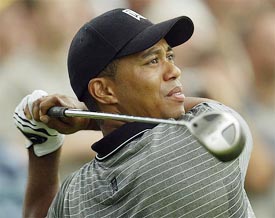 Tiger Woods takes a tee shot on the 14th hole during the first day of practice for the forthcoming 85th PGA Championship