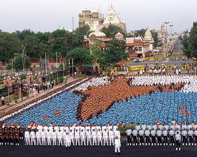 Children, dressed in multicoloured uniforms, form a map of India during a full dress rehearsal for the Independence Day celebrations