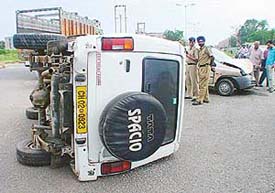 Three Tribune employees were injured when the Tata Sumo by which they were travelling overturned on the road 