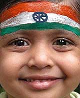 A child, with the Tricolour painted on his forehead, attend a function on the eve of Independence Day