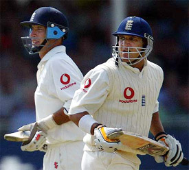 England�s Nasser Hussain and Mark Butcher take a run on the first day of the third Test match against South Africa