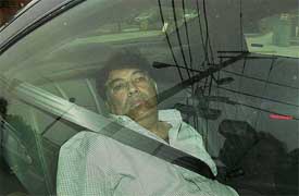 Hemant Lakhani is driven by FBI agents into the federal courthouse in Newark for a hearing