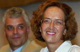 Astrid Bouteuil poses for photographers with her brother