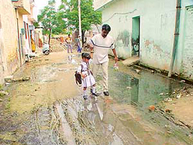 An unpaved street inundated by sullage and waste water in New Sant Nagar locality in Haibowal, Ludhiana.