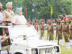 Mr Tej Parkash Singh, Transport Minister, Punjab, inspects the parade after hoisting the National Flag at an Independence Day function in Ludhiana on Friday. 