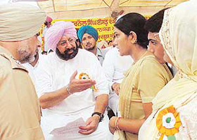Relatives of Shaheed Karnail Singh Isru share their grievance with Capt Amarinder Singh, Chief Minister, Punjab, during a function at Isru village in Ludhiana on Friday.