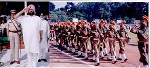 Punjab Chief Minister Amarinder Singh takes the salute during a marchpast on Independence Day at the Guru Nanak Stadium in Kapurthala 