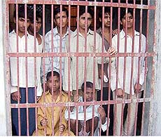 Eight Pakistani teenagers behind the bars of a juvenile home in Faridkot