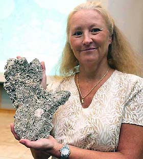 Dr Shelly Williams displays a plaster cast of the footprint of a big elusive ape