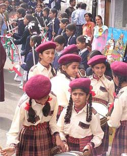 Schoolgirls perform during a Janamashtmi procession