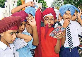 Schoolchildren take part in a "dastarbandi" competition at Gurdwara Sahib, Sector 37-D, Chandigarh