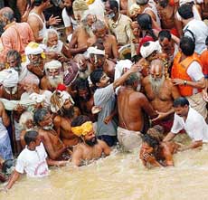 Sadhus of the Vaishnav sect participate in the ‘Shahi Snan’ in the Godavari at Ramkund in Nasik