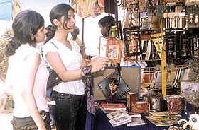 Girls shopping around at the �Sawan Saras 2003� mela at Dilli Haat in the Capital on Sunday. 