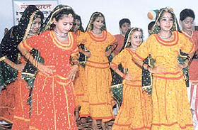 Students of Sant Nirankari Public School presenting a colourful programme.