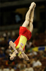 China's Xiao-Peng Li flips upside-down as he performs his floor routine at the World Gymnastics Championships 