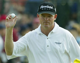 Shaun Micheel celebrates after recovering a par on the 11th hole