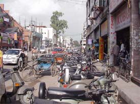 Indiscriminate parking outside a commercial complex in Bhadaur House takes the toll of traffic movement