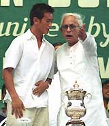 West Bengal Chief Minister Buddhadev Bhattacharya with East Bengal's star striker Baichuing Bhutia 