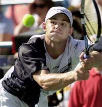 Andy Roddick of the US returns a backhand against compatriot Mardy Fish