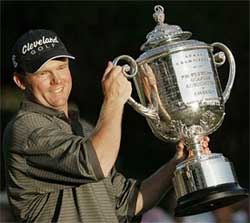 Shaun Micheel holds the PGA Championship trophy after the final round of the 85th PGA Championship at the Oak Hill Country Club