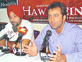 Ammtoje Mann, writer, director and actor of Hindi movie Hawayein� (right), addresses a press conference in Chandigarh on Tuesday. Singer and music director of the film Babbu Mann is also seen. 