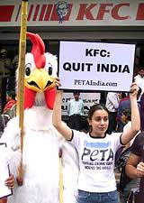 A PETA member protests in front of a Kentucky Fried Chicken restaurant