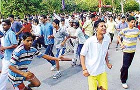 Participants take part in a race "Run for Nation" on the occasion of the 59th birth anniversary of the late Rajiv Gandhi in Sector 17, Chandigarh