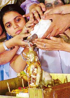 ISKCON devotees perform "Kalash Abhishek" on the occasion of Janmashthmi at Hare Krishna Dham, Sector 36-B, Chandigarh
