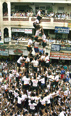 Men form a human pyramid to reach the �matka� as part of the Janmashthmi celebrations in Mumbai on Wednesday. 