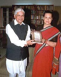 Mr Ashwani Kumar, Congress Rajya Sabha MP from Punjab, presents a copy of his book to party President Sonia Gandhi