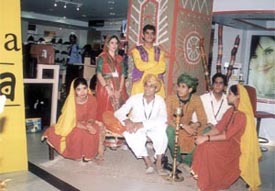 A folk dance group at Shoppers� Stop
