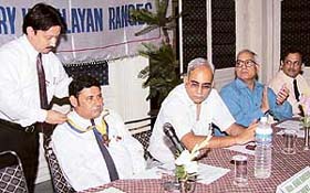 Rtn T.K. Ruby, outgoing president, installs Rtn Anil Oberoi, president for 2003-2004 of Rotary Club, Chandigarh Himalayan Ranges, in Chandigarh