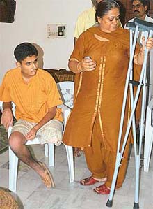A weeping Mrs Anuradha Ahluwalia giving details of her son�s case, Abhishek, whose leg had to be amputated after a simple fracture at her residence in Manimajra