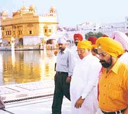 Former Haryana Chief Minister Bhajan Lal arrives to pay obeisance at the Golden Temple