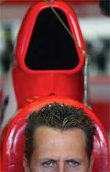 Germany's Ferrari driver Michael Schumacher sits in his car 