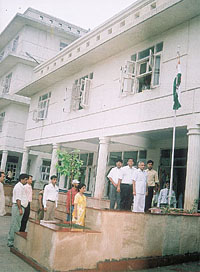 Dr Bhupendra Singh, Deputy Director of Education, North- West district, hoisting the national flag in Ganga International School. 