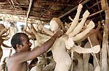 An artisan busy modelling the clay image of Goddess Durga