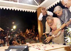 Gujarat Chief Minister Narendra Modi places the urn