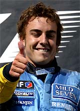 Spanish Renault driver Fernando Alonso flashes a thumbs-up sign after winning the Hungarian Grand Prix